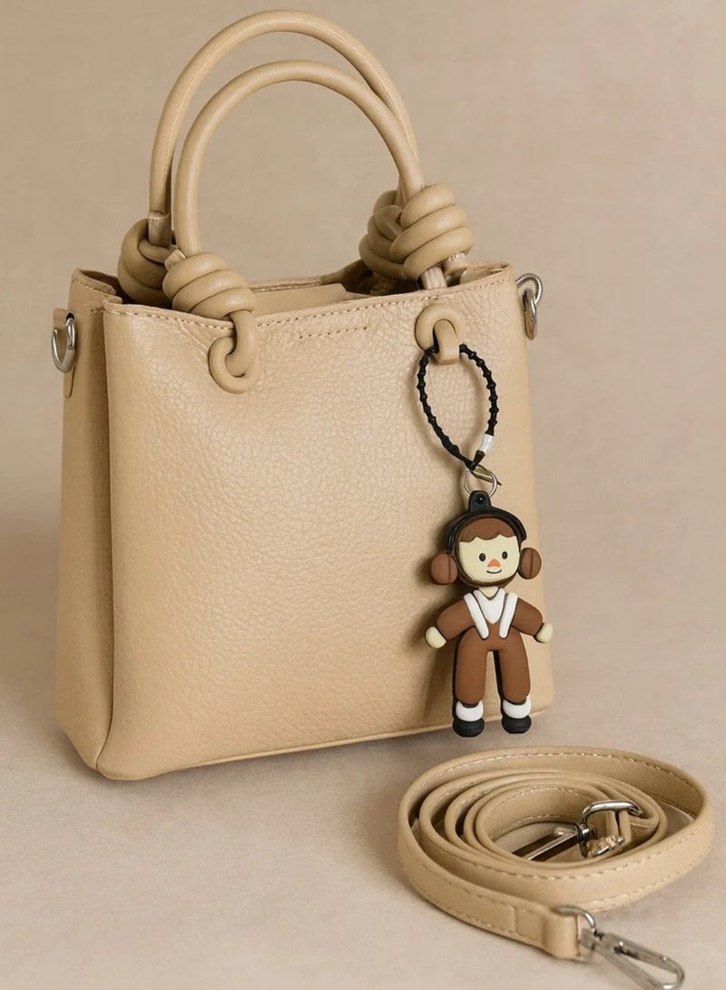 Women’s Medium Leather Crossbody Handbag with Cute Doll Charm – Elegant Design for Daily Use - Image 1