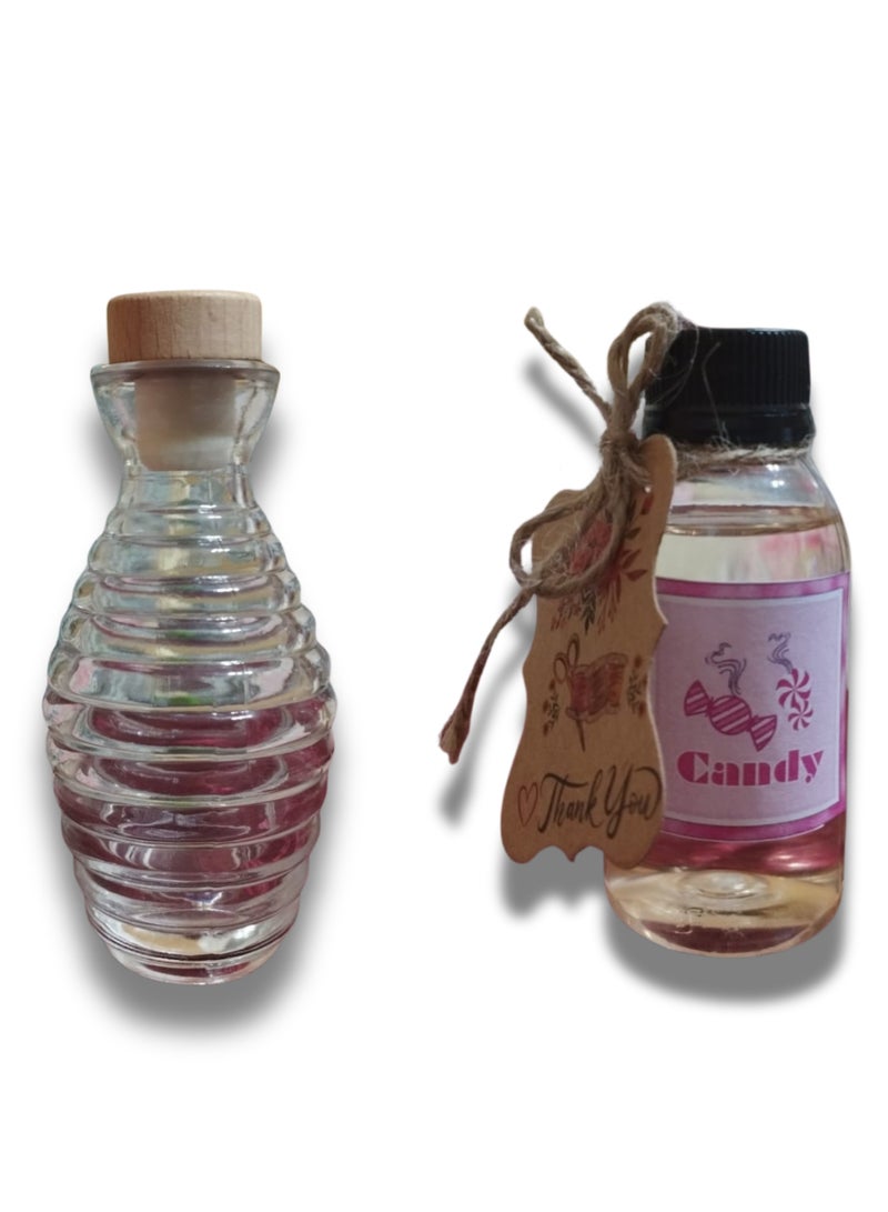 A stick diffuser in a clear, patterned glass vase with a distinctive candy scent, a distinctive color and fragrance, and a concentrated 100 ml fragrance - elegant decorative design and a long-lasting fragrance - ideal for gifts and special occasions.  - Image 2