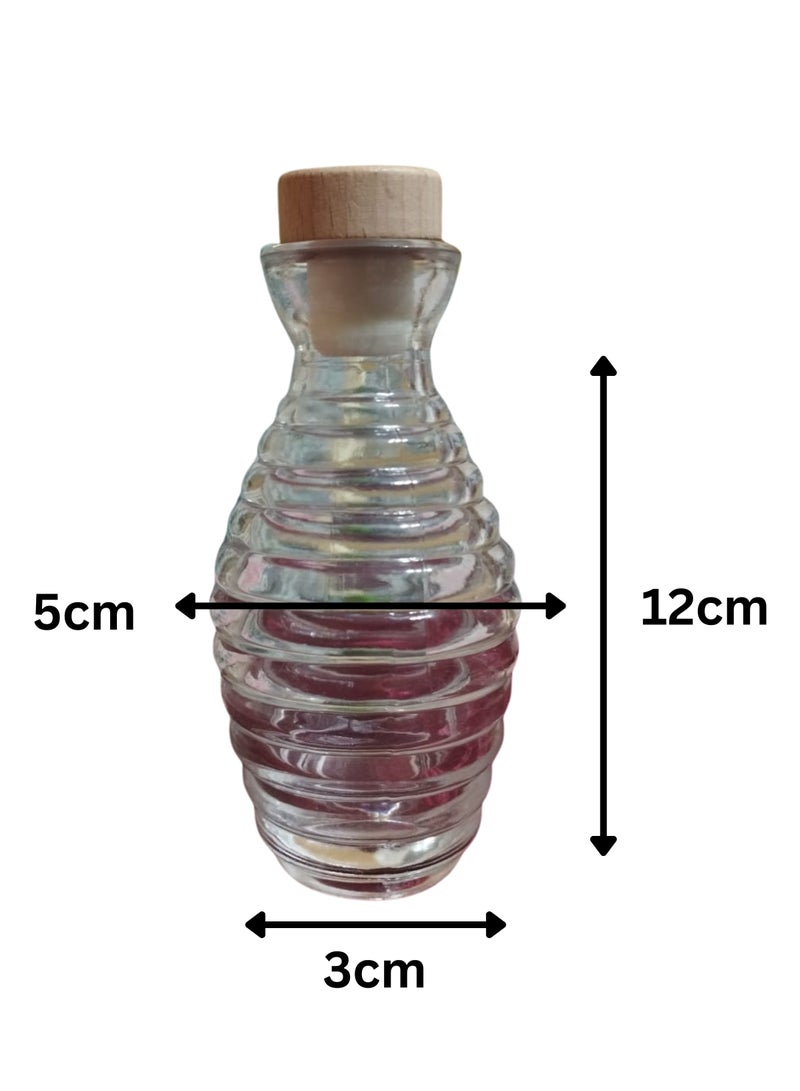 A stick diffuser in a clear, patterned glass vase with a distinctive candy scent, a distinctive color and fragrance, and a concentrated 100 ml fragrance - elegant decorative design and a long-lasting fragrance - ideal for gifts and special occasions.  - Image 3