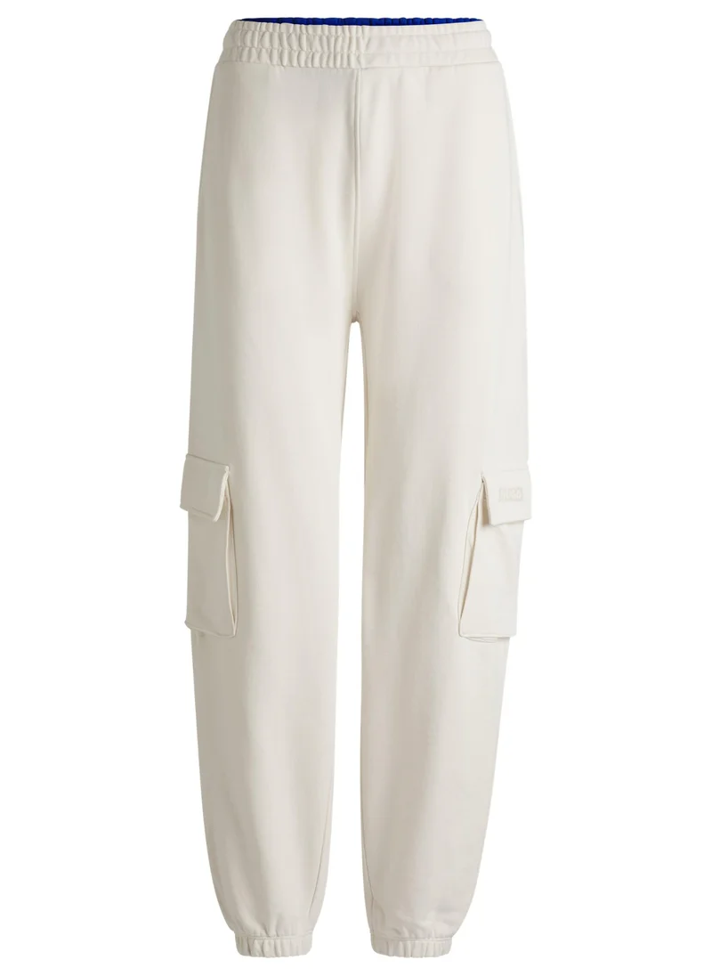 HUGO Cargo-style tracksuit bottoms in cotton terry