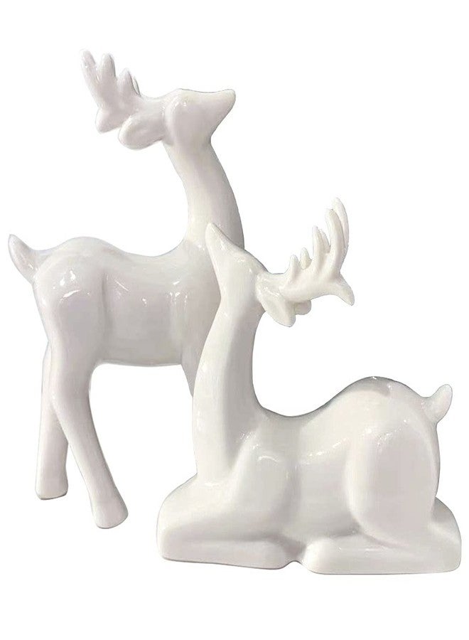 KiaoTime Porcelain Christmas Reindeer Figurines, Pack 2 Mini Animal Reindeer Decor Deer Statues Sculpture Tabletop Ornaments for Cabinet Mantel Shelves Fireplace Home Décor Accents Collectible Figurines - Image 1