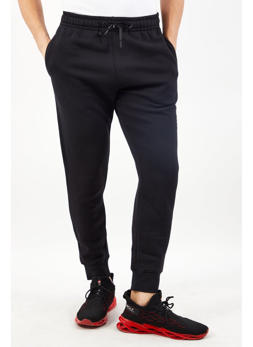 DKNY Sport Men Sportswear Fit Brand Logo Outdoors Jogger Pants, Black  - Image 1