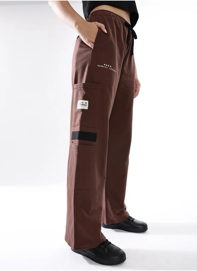 هوبرهولمي Women Track Pants in Brown featuring Jogger fit with a printed pattern, no sleeves, regular length, secured with elasicated + drawstring closure, crafted from terry – an essential addition to your stylish collection.