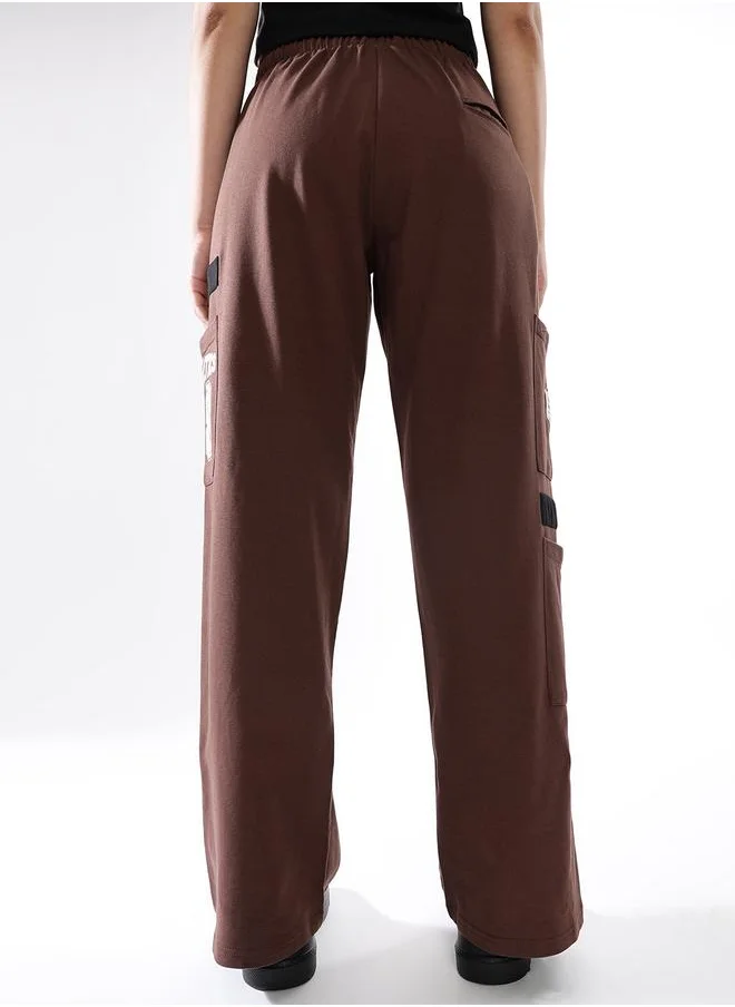 هوبرهولمي Women Track Pants in Brown featuring Jogger fit with a printed pattern, no sleeves, regular length, secured with elasicated + drawstring closure, crafted from terry – an essential addition to your stylish collection.