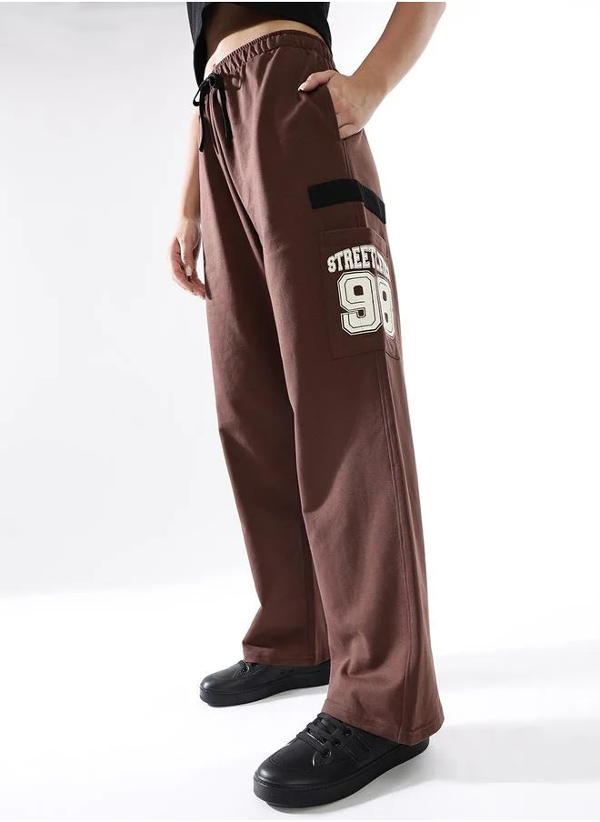 هوبرهولمي Women Track Pants in Brown featuring Jogger fit with a printed pattern, no sleeves, regular length, secured with elasicated + drawstring closure, crafted from terry – an essential addition to your stylish collection.