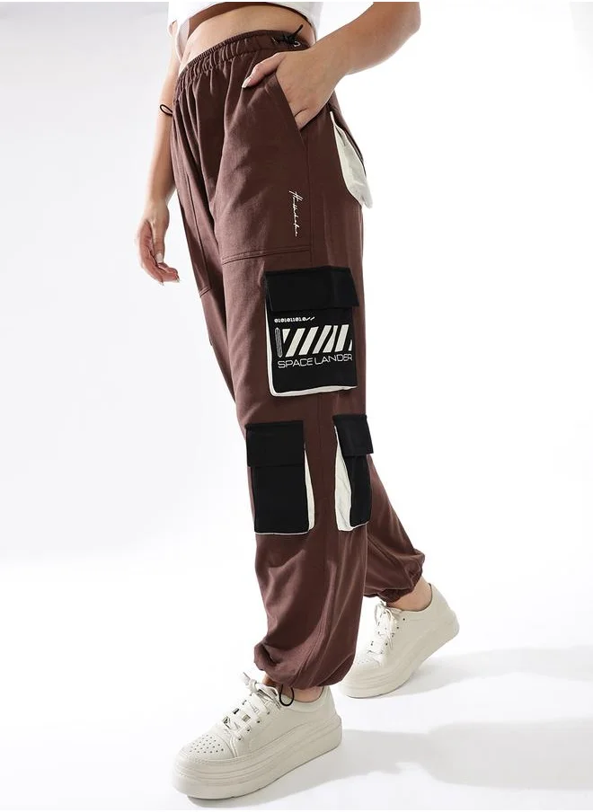 هوبرهولمي Women Track Pants in Multicolor featuring Jogger fit with a printed pattern, no sleeves, regular length, secured with elasicated + drawstring closure, crafted from terry – a must-have for those who love trendy fashion.