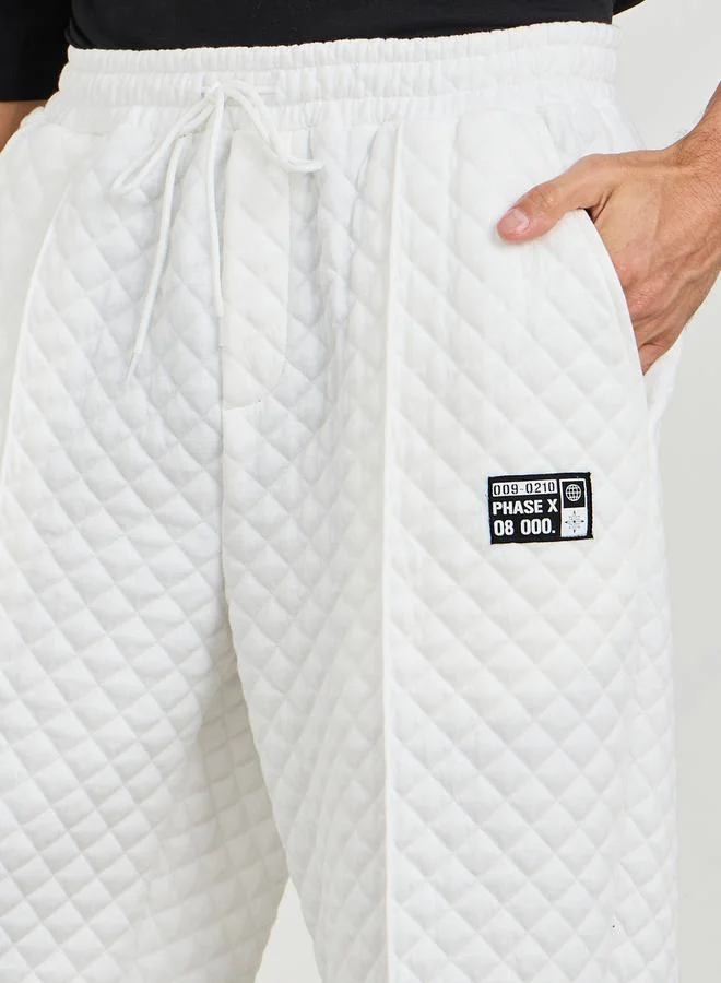 Styli Relaxed Fit Open Hem Quilted Pants with Badge Detail