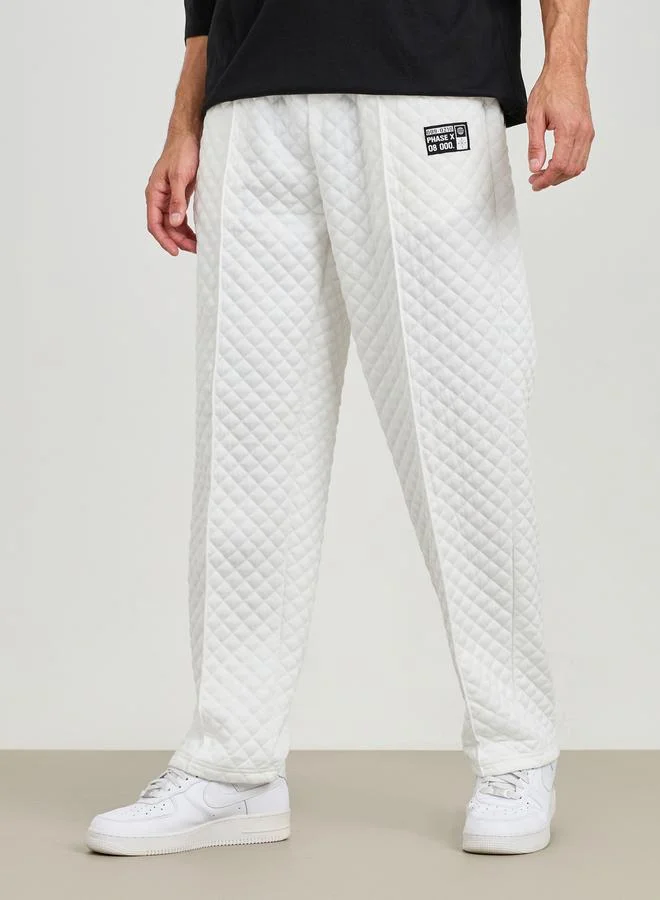 Styli Relaxed Fit Open Hem Quilted Pants with Badge Detail