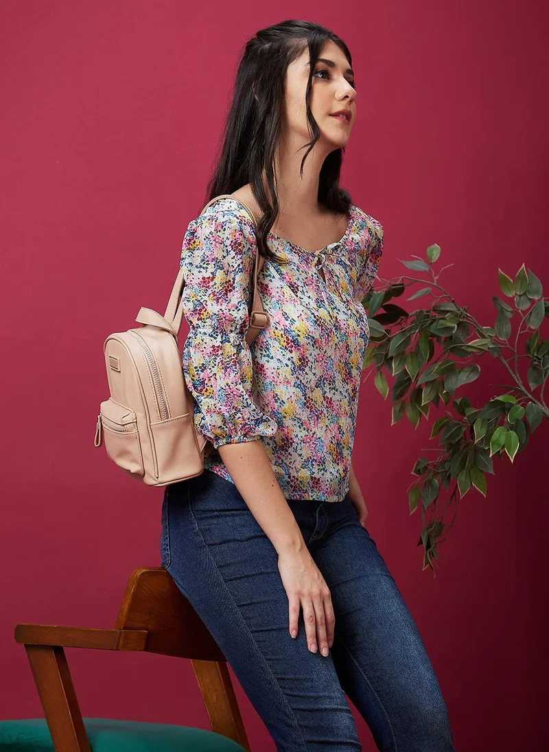 جلو باص بلوزة نسائية بأكمام منفوخة ورباط بطبعة تجريدية زرقاء