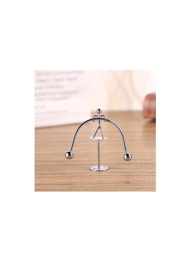 Generic - "Enjoy an experience of balance and calm with the Newton's Cradle - elegant design, smooth movement, and a clever decorative touch that adds a sophisticated scientific touch to your office or home. " - Image 1