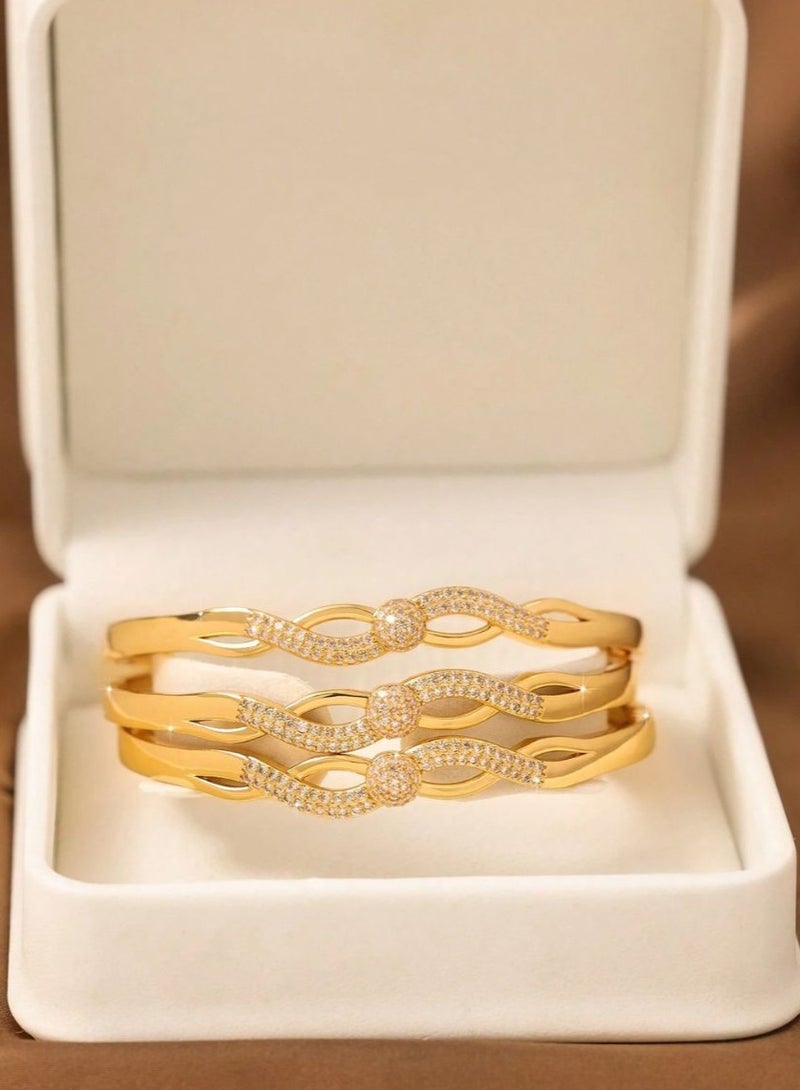 Women's Bracelets – A set of 3 gold-plated bangles adorned with sparkling zircon stones in a twisted design. Perfect for weddings, engagements, graduation gifts, Mother's Day, Valentine's Day, and all special occasions. - Image 1