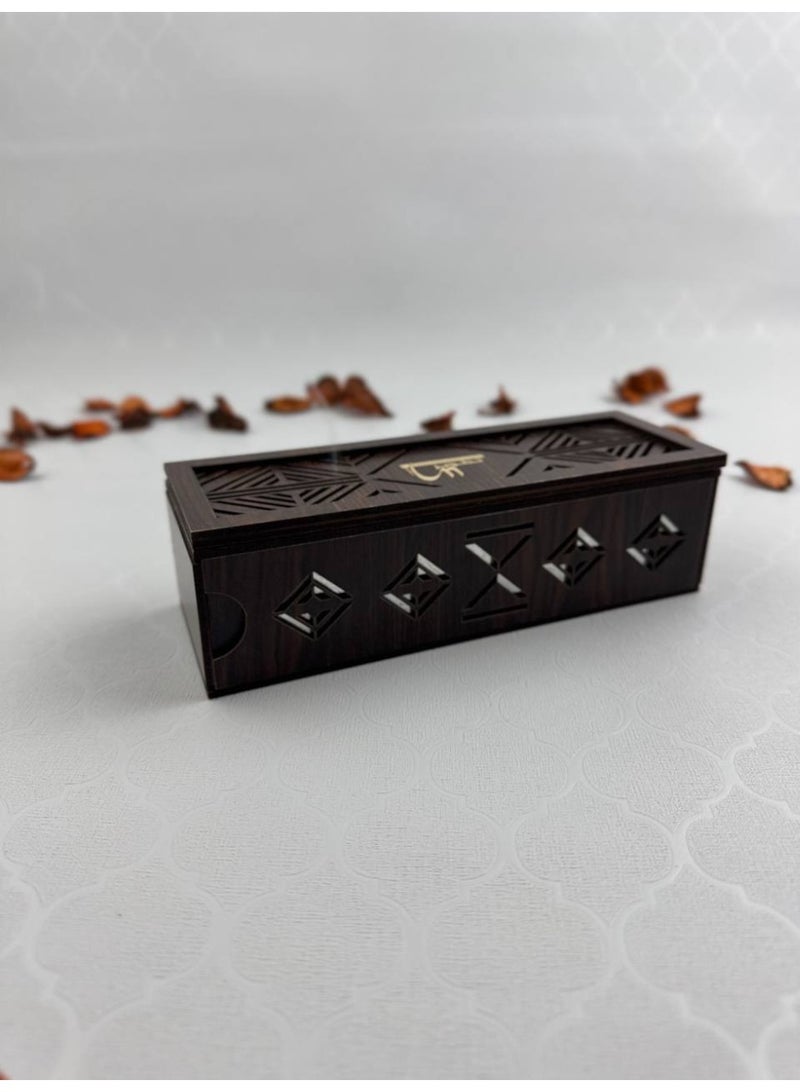 Samrix The Abaq Al Dar incense burner is a wooden burner with acrylic decorations. It includes a drawer at the bottom for storing incense sticks (30 sticks included) and a top compartment for lighting the sticks. It is safe, non-flammable, and has a magnetic closure. - Image 1