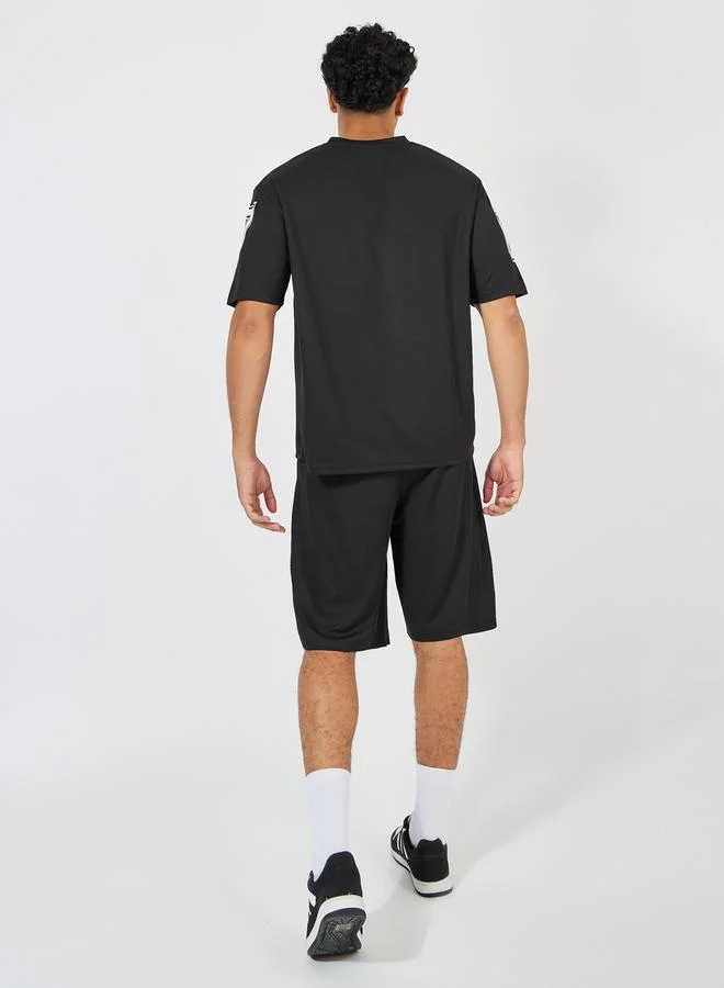 Styli Printed Oversized Varsity V Neck T-Shirt & Shorts Co-Ords