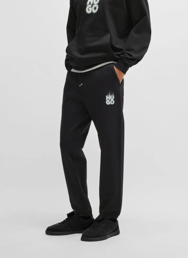 HUGO Cotton-terry tracksuit bottoms with smoke logo