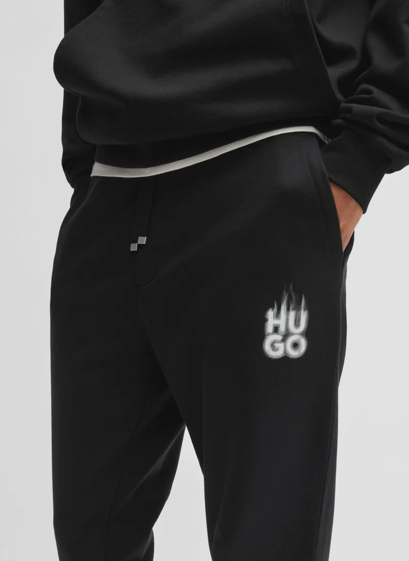 HUGO Cotton-terry tracksuit bottoms with smoke logo