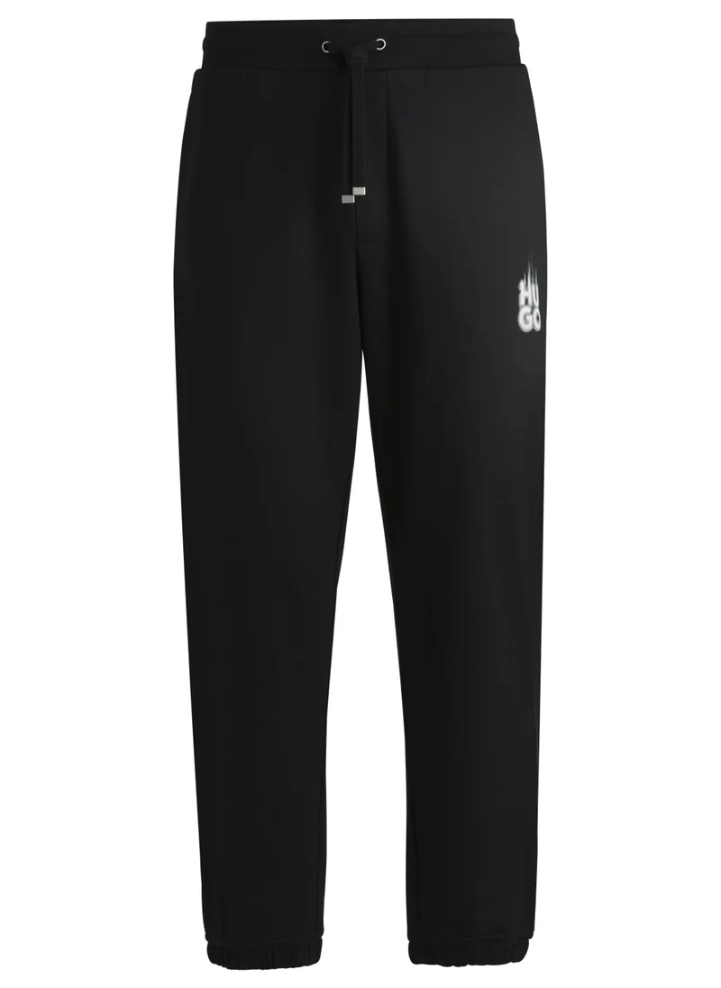 HUGO Cotton-terry tracksuit bottoms with smoke logo