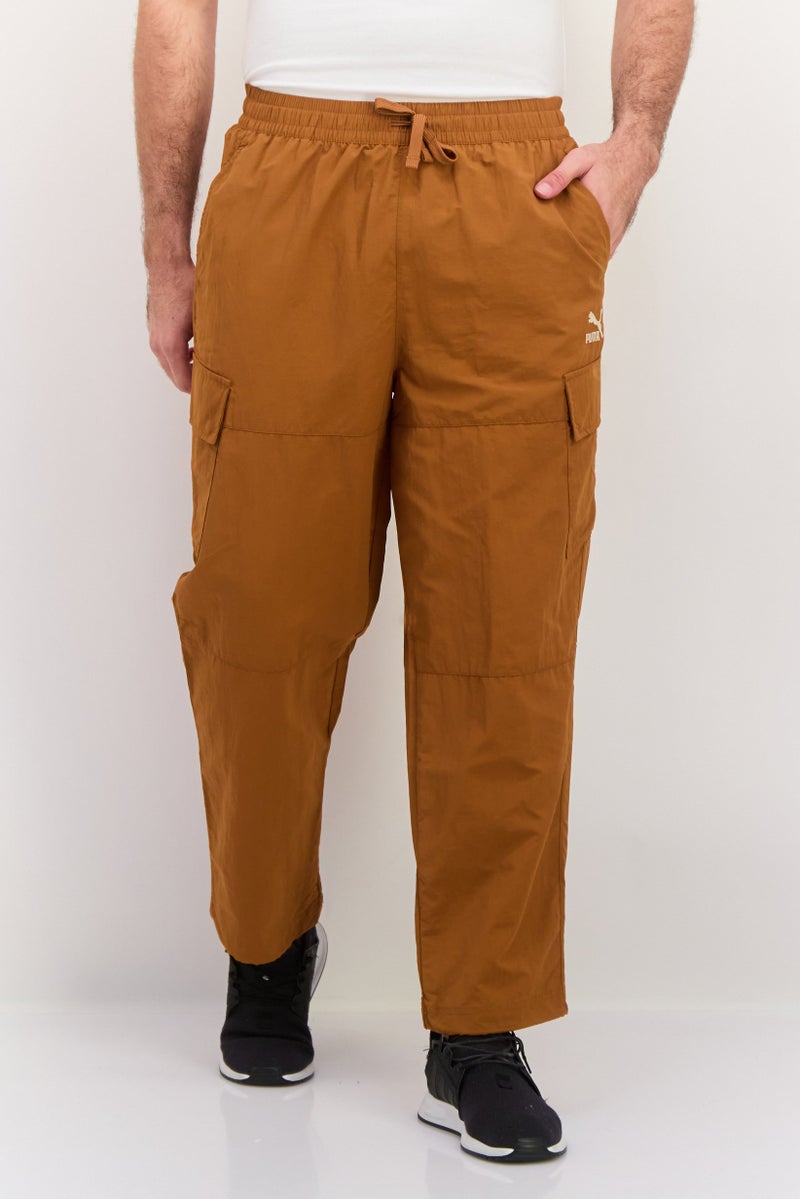 PUMA Men Sportswear Fit Drawstring Outdoor Track Pants, Brown - Image 1