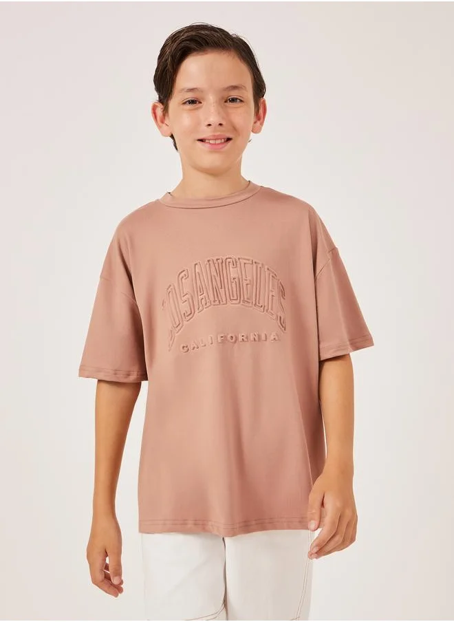 ستايلي Styli Embossed Slogan Round Neck Oversized T-Shirt