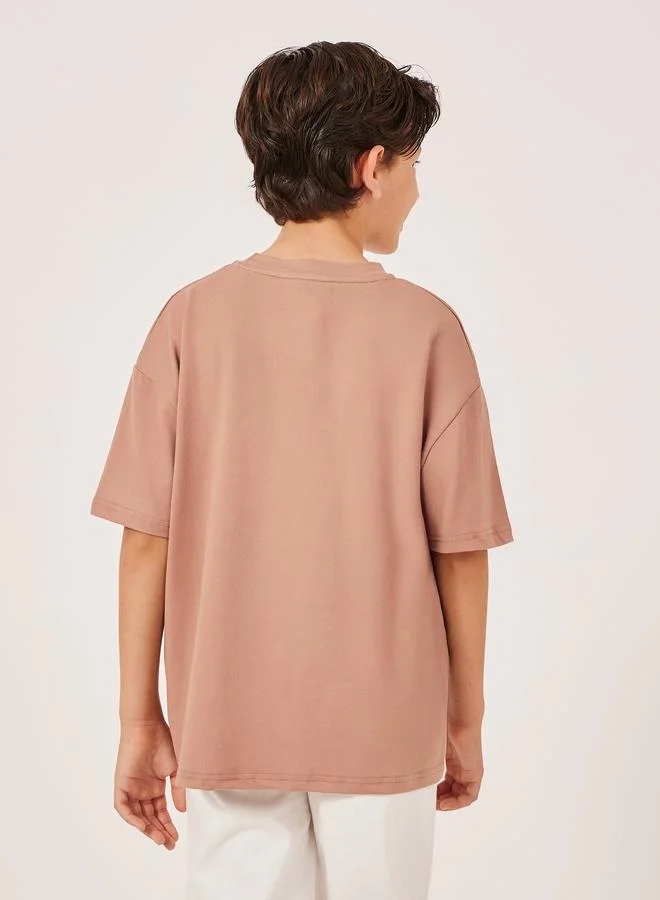 Styli Embossed Slogan Round Neck Oversized T-Shirt