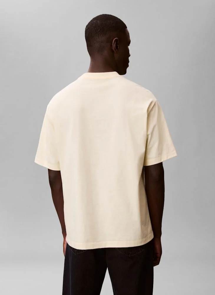 Calvin Klein Jeans  Relaxed Fit Logo Graphic T-Shirt for Men | Best Price UAE