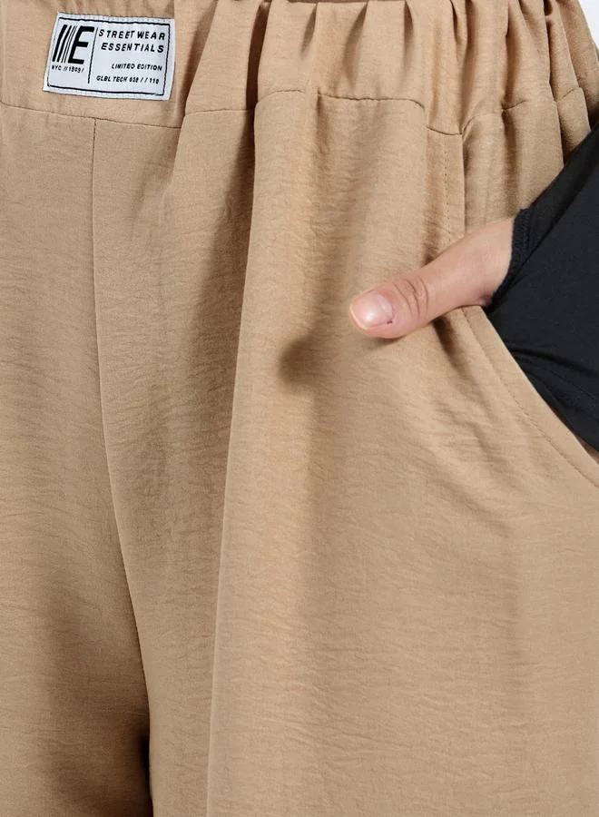 Styli Textured Mid Rise Wide Leg Pants with Badge Detail