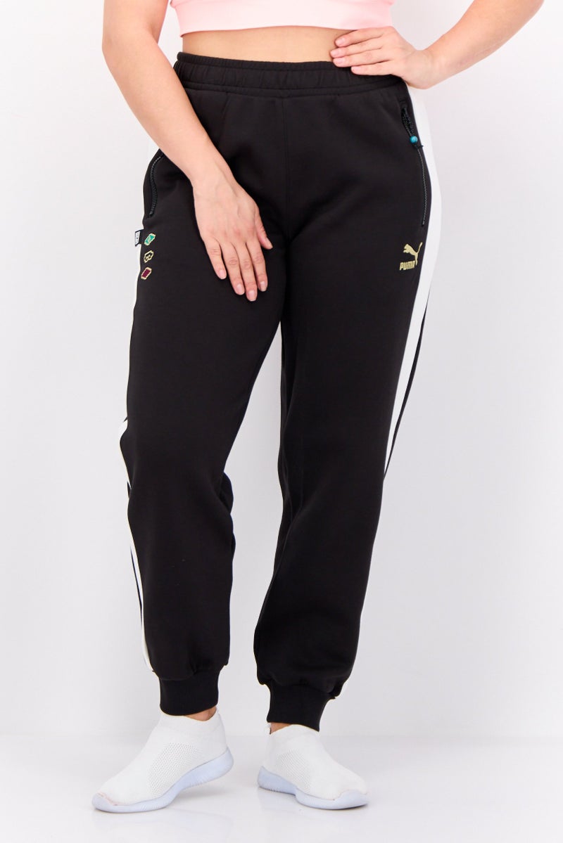 PUMA Women Relaxed Fit Outdoor Track Pants, Black - Image 1