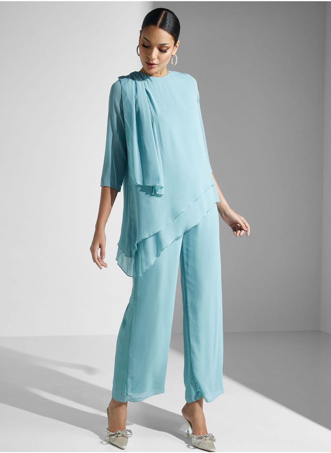 Asymmetrical Styled Hem Jumpsuit - https://f.nooncdn.com/p/pzsku/ZDA9C0C1768AD2EED8EDCZ/45/_/1713784222/6d8079af-69a0-4acd-aae7-40ead44c7d5b.jpg?format=jpg&width=original