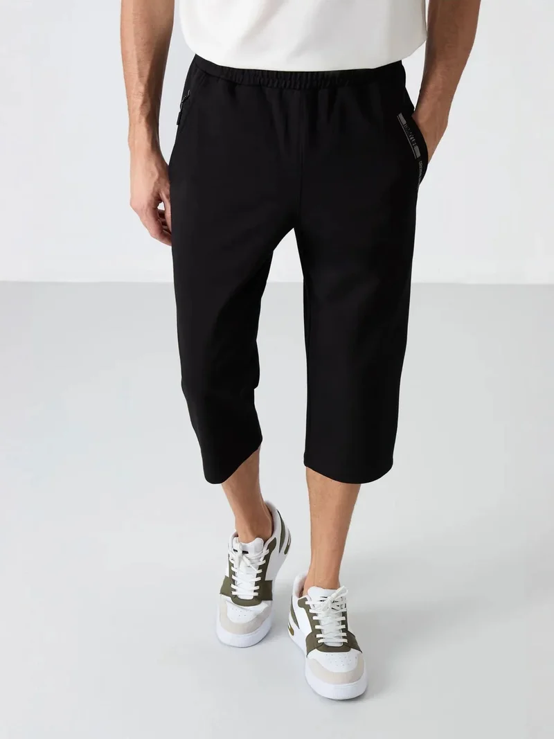 تومي لايف TOMMY Men's Mid-Waist Capri Shorts