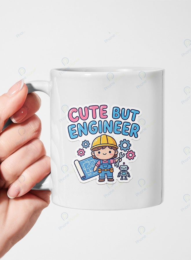 A ceramic mug printed with the phrase cute but engineer and featuring a comfortable handle