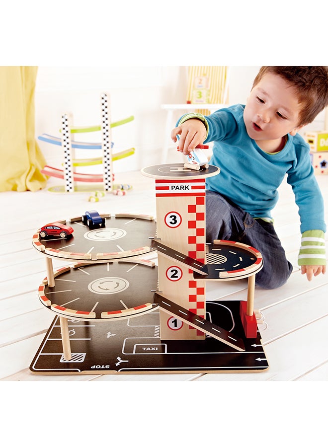 Hape Park and Go Kids Wooden Toy Car Garage Playset by Hape | Car Ramp with Four Parking Levels, 2 Toy Cars, 1 Toy Helicopter, an Elevator and Fueling Station - Image 5