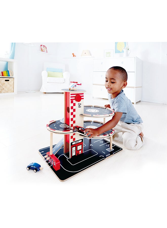 Hape Park and Go Kids Wooden Toy Car Garage Playset by Hape | Car Ramp with Four Parking Levels, 2 Toy Cars, 1 Toy Helicopter, an Elevator and Fueling Station - Image 3