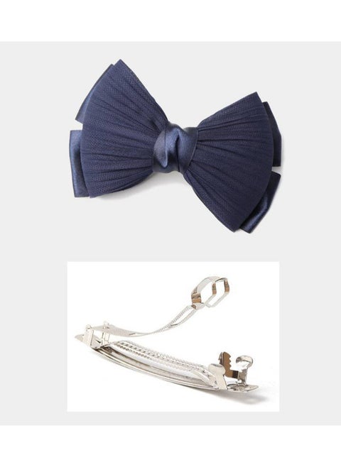 "Bow hair clip with satin ribbon in navy blue, a soft touch that adds femininity and beauty to your look."