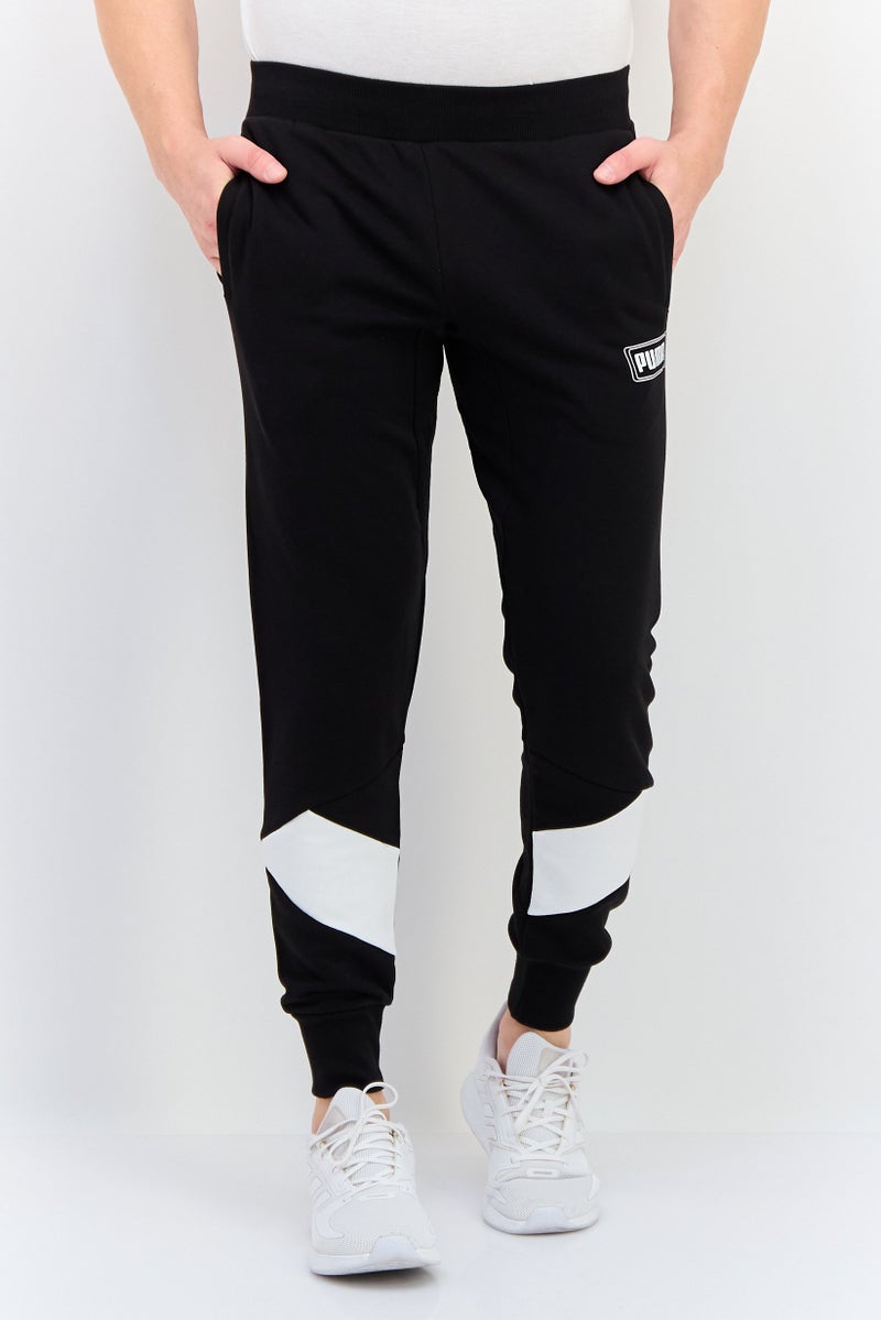 PUMA Men Regular Fit Brand Logo Outdoor Sweatpants, Black - Image 1
