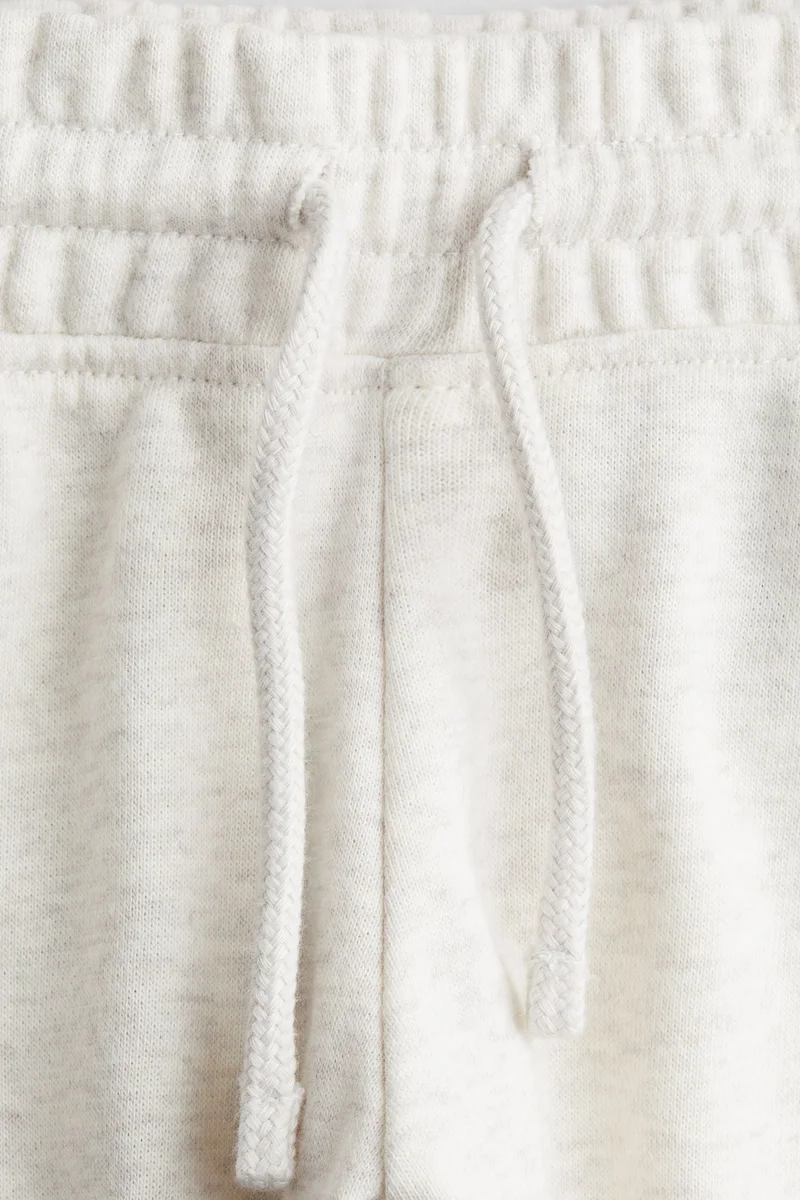 اتش اند ام بنطلون رياضي بحافة واسعة