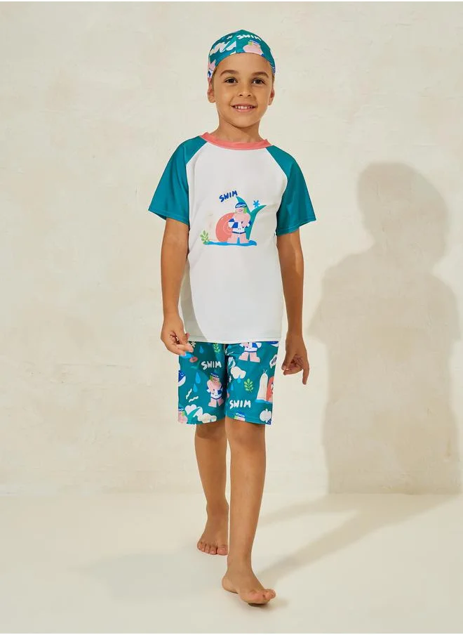 ستايلي Cartoon Print T-Shirt, Cap & Shorts Swim Set