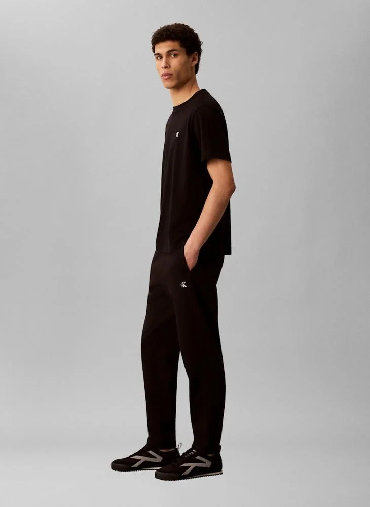 Calvin Klein Jeans Black Relaxed Cotton Terry Joggers for Men | Best Price UAE