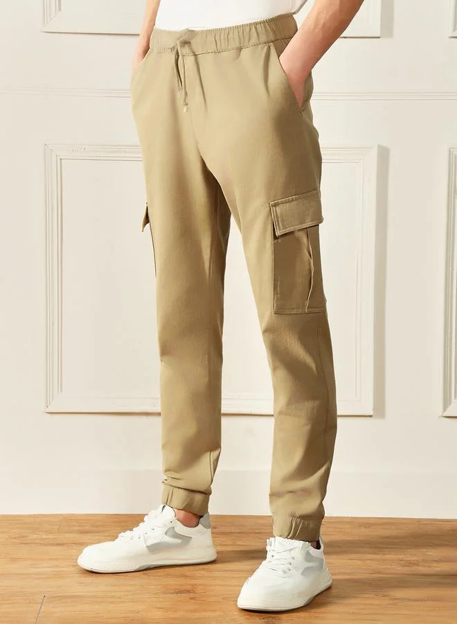 Dennis Lingo Slim Fit Khaki Men's Cotton Lycra Solid Cargo Trouser, Mid Rise, Full Length, Casual,