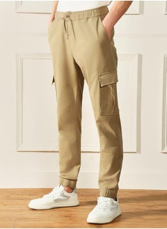 Slim Fit Khaki Men's Cotton Lycra Solid Cargo Trouser, Mid Rise, Full Length, Casual - pzsku/ZDB61FBFFC8BA50864F5BZ/45/_/1725724824/7b27eb6a-3cbf-416c-82f4-a84269ff318c