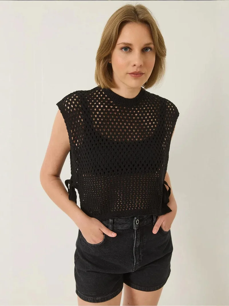 بيانكو لوتشي سترة قصيرة فضفاضة من لوكسي بنسيج محكم مع رباط