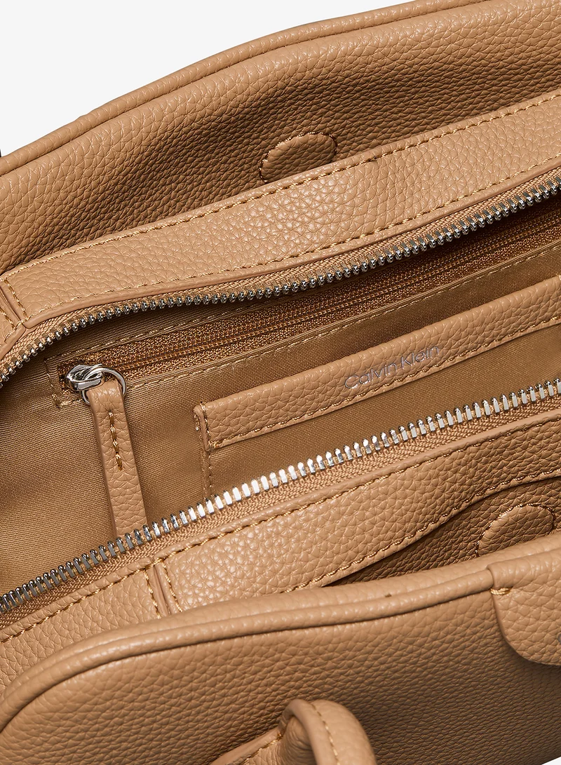 Calvin Klein Tannin Emblem Pebble Grain Extended Side Shoulder Bag for Women | Best Price UAE
