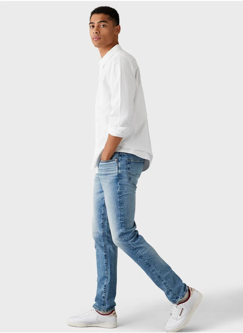 امريكان ايجل Mid Wash Slim Fit Jeans