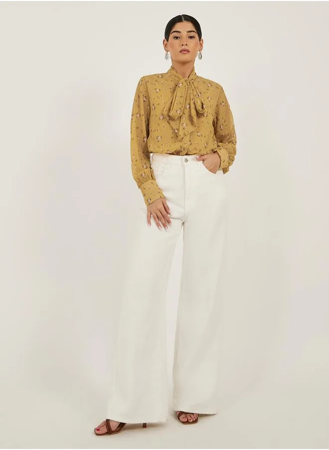 Styli Floral Print Textured Tie-Up Neck Blouse