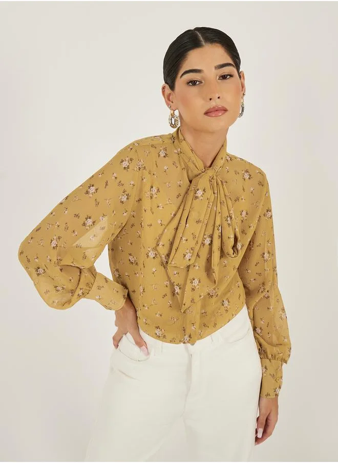 Styli Floral Print Textured Tie-Up Neck Blouse