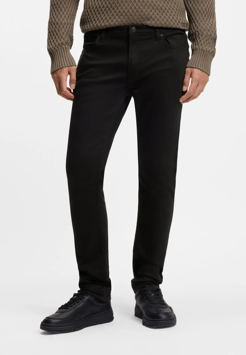 هوجو جينز نحيف للغاية بلون أسود فائق من قماش دينم مطاطي