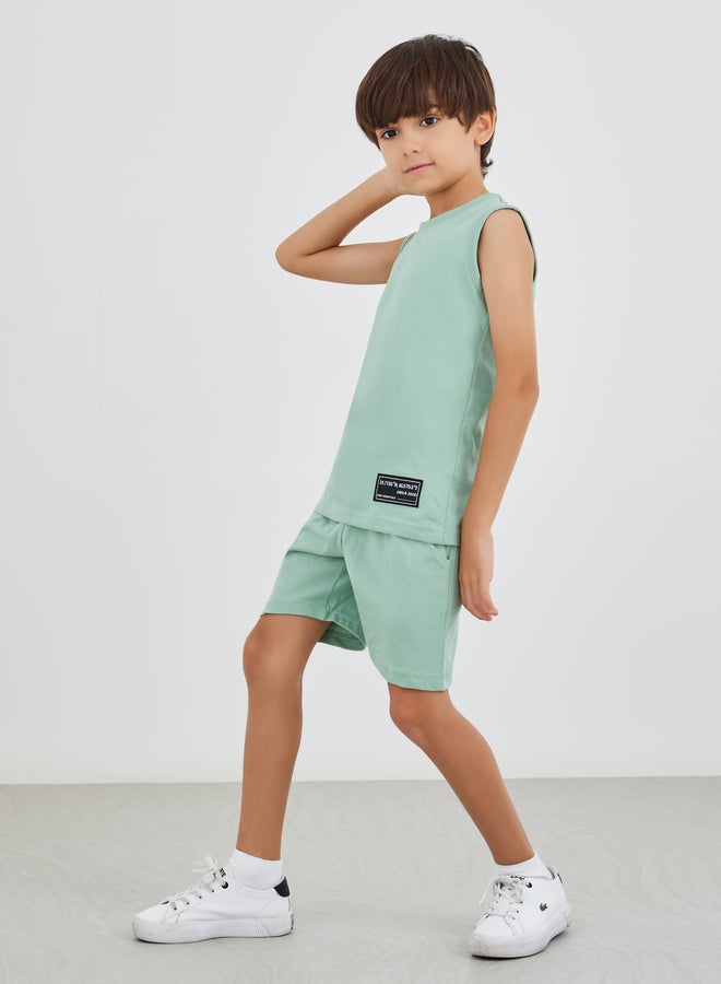 Styli Solid Badge Detail Sleeveless T-Shirt and Shorts Set - Image 1