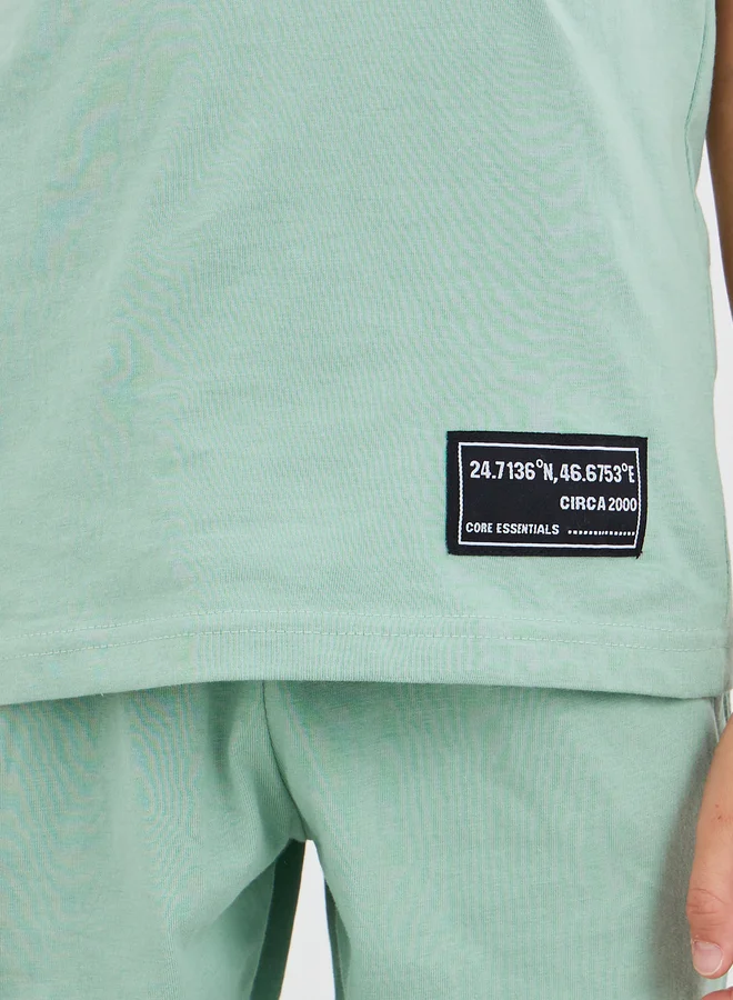 Styli Styli Solid Badge Detail Sleeveless T-Shirt and Shorts Set