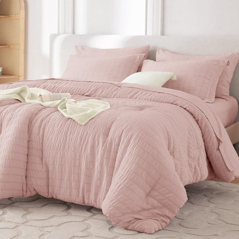 MUXHOMO 7 Pieces Queen Comforter Set, Seersucker Bed in a Bag Queen Size, All Season Luxury Bedding Set with Comforter, Flat Sheet, Fitted Sheet, Pillowcases & Shams, Rose Gold - Image 1