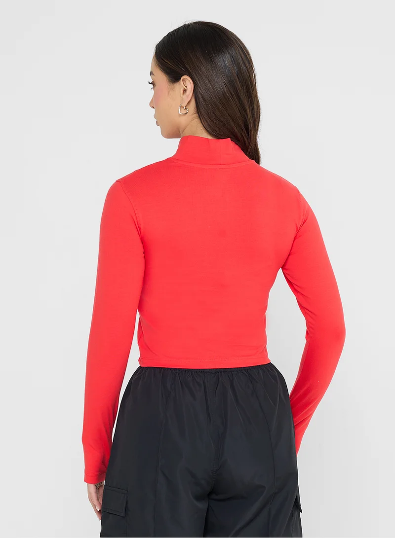 ريبوك Jade Roll Neck Slim Croped T-Shirt