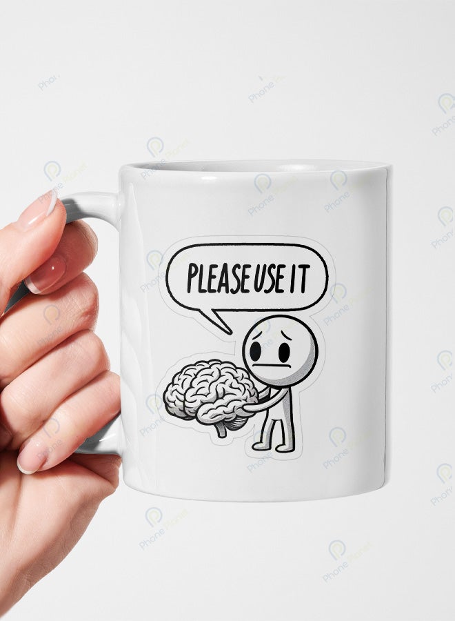 A ceramic mug printed with the phrase Please use it and featuring a comfortable handle