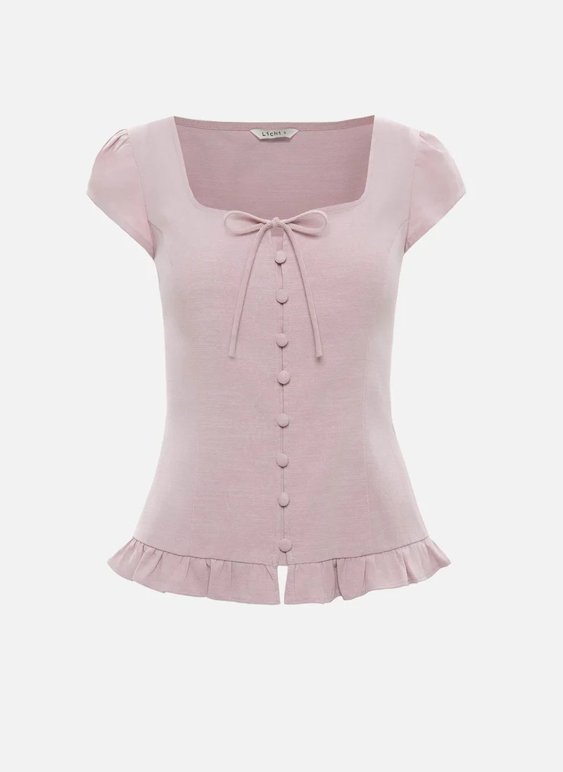 Lichi Fitted top with short sleeves and ruffles at the hem